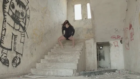 Modern dancer on the steps of an abandoned building Stock Footage 81276611