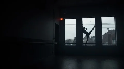 Modern dancer on window sill dancing, stretching legs in dance studio 스톡 동영상 104275750
