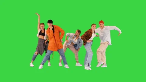 Modern dancers changing poses to the rhythm on a Green Screen, Chroma Key. Stock Footage 219474680