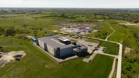 Modern data center building connecting high voltage electrical substation 写真素材