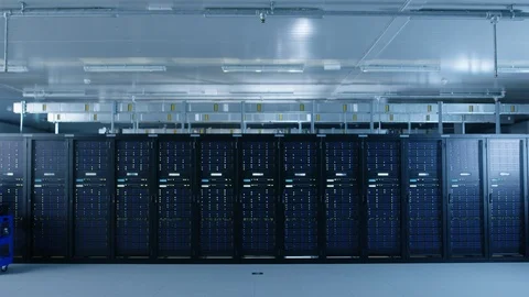 In the Modern Data Center: IT Engineer Working with Server Racks, Pushes Cart 库存影片 101180440