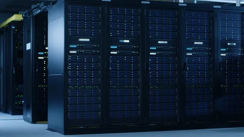 In the Modern Data Center: IT Engineer Working with Server Racks, Pushes Cart 库存影片 101184612