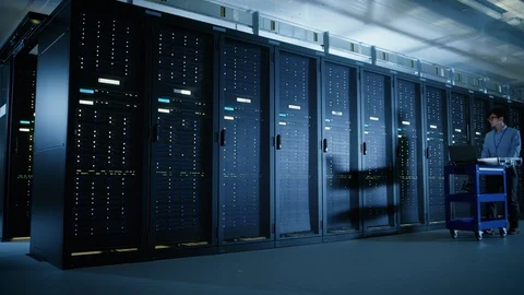 In the Modern Data Center: IT Engineer Doing Maintenance and Diagnostics. Stock Footage 101188288