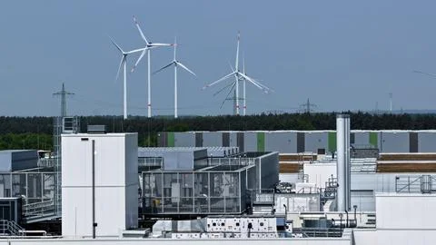 Modern Data Center with Wind Turbines in Background Landscape Fotos Stock