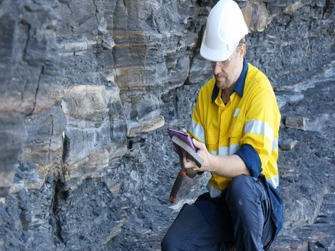 Modern data collection Geologist is field taking notes for mineral exploration Stock Footage 78592118
