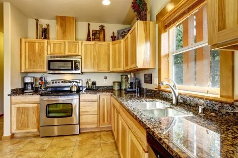 Modern day kitchen with tile floor. Stock Photos