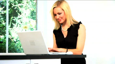 Modern day woman working from home Stock Footage