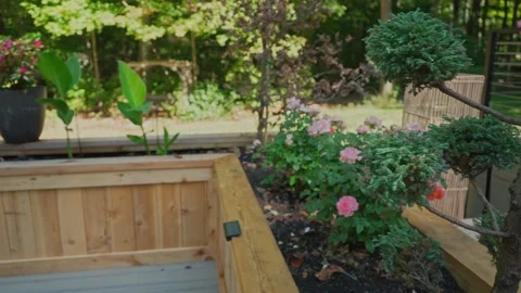 Modern Deck with Built-In Flower Bed | Backyard Landscaping B-Roll Stock Footage 318904694