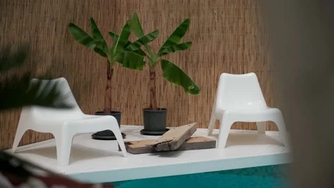 Modern deck chairs near the pool 스톡 동영상 133564110