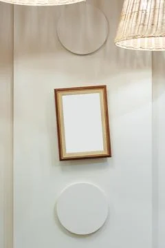 Modern decor with simple shapes and an empty frame on a light wall Stock Photos