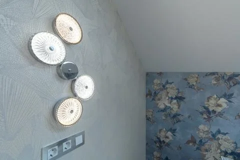 Modern Decorative Wall Sconces in Elegant Attic Bedroom Stock Photos