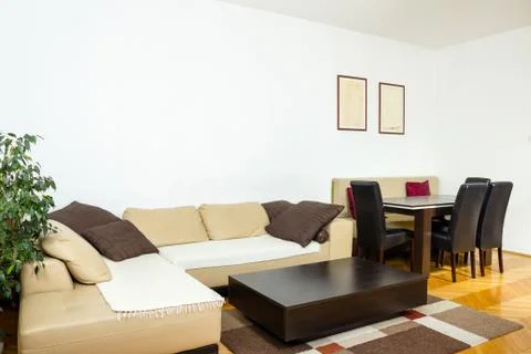 Modern design of home with sofa corner. Pleasant interior Stock Photos