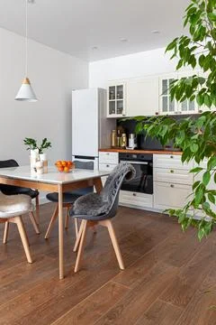 Modern design interior of dining room, kitchen, white furniture Stock Photos
