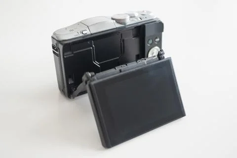 A modern-design mirrorless digital camera with an articulated screen Stock Photos