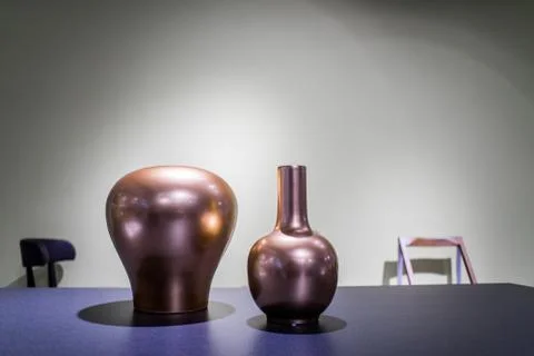 Modern design vases on loft table interior Foto stock