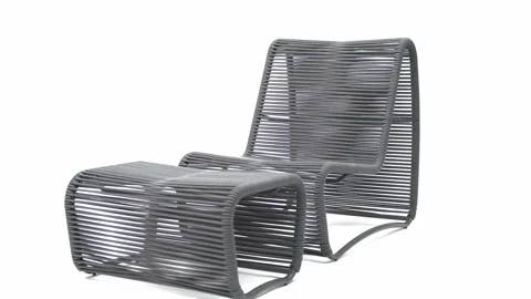 Modern designer chaise consisting of a rope chair and pouffe Stock Footage 220073544
