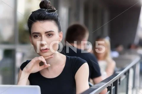 Modern designer working outside of a building Stock Photos