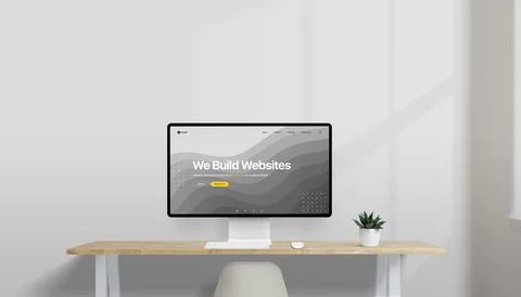 Modern desk setup with computer displaying a concept web design Foto stock