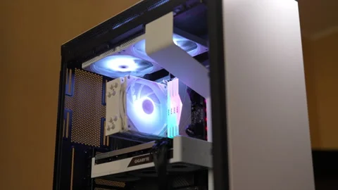 Modern desktop computer case with colourful RGB lighting illuminating internal Stock Footage 292448805
