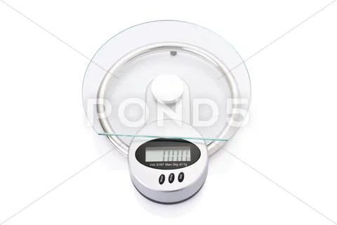 Modern digital kitchen scale isolated on white background. Stock Photos
