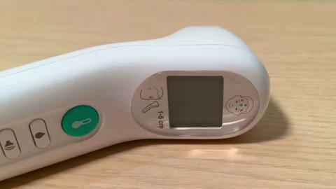 Modern digital thermometer ready for quick temperature checks, ensuring health Video stock 318610808