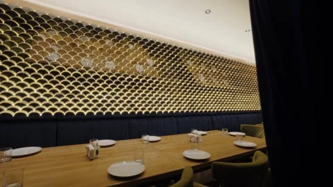 Modern Dining Area with Gold Patterned Wall Design Stock Footage 302499678