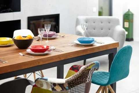 Modern dining room with dining table.  Small depth of field Stock Photos