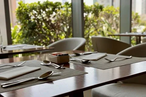 Modern dining set up at a cozy restaurant during daytime Stock Photos