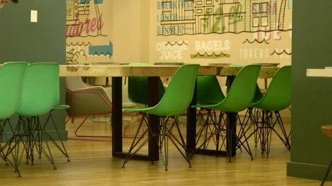 Modern Dining Table and Green Chairs in Office Lounge Stock Footage 343880427