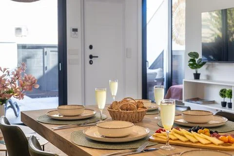 Modern Dining Table Set For Breakfast In Bright Living Space Stock Photos