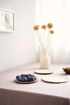Modern dining table setting. Only natural materials - earthenware, linen Stock Photos