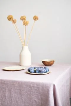 Modern dining table setting. Only natural materials - earthenware, linen Stock Photos