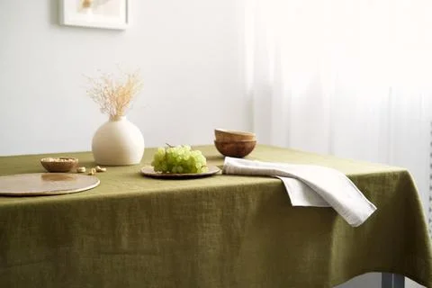 Modern dining table setting. Only natural materials - earthenware, linen Stock Photos