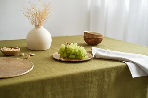 Modern dining table setting. Only natural materials - earthenware, linen Stock Photos