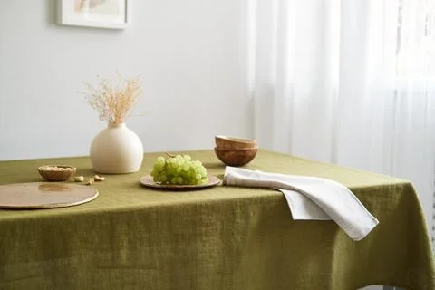 Modern dining table setting. Only natural materials - earthenware, linen Stock Photos