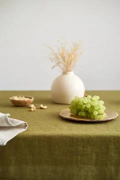 Modern dining table setting. Only natural materials - earthenware, linen Stock Photos