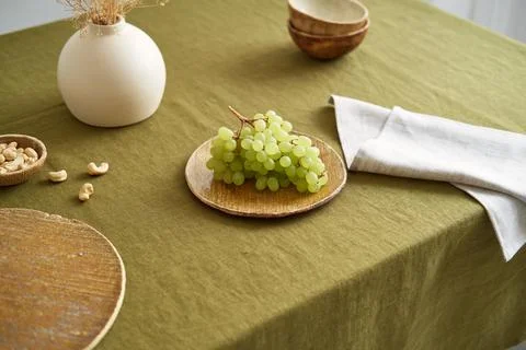 Modern dining table setting. Only natural materials - earthenware, linen Stock Photos