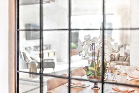 Modern dining table view through the glass window Stock Photos