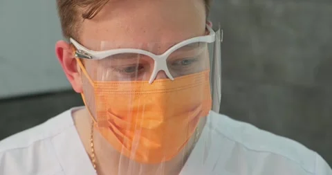 Modern doctor close-up in mask while working in medical hospital Stock Footage 197991282