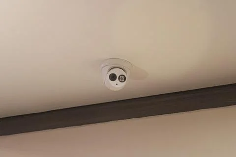 Modern Dome CCTV Security Camera Installed on the Ceiling Stock Photos