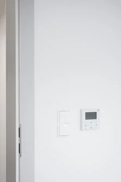 Modern Door Frame with Light Switch and Control Panel Stock Photos