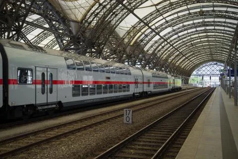 The modern double-decked passenger train on the railway station of Dresden Stock Photos