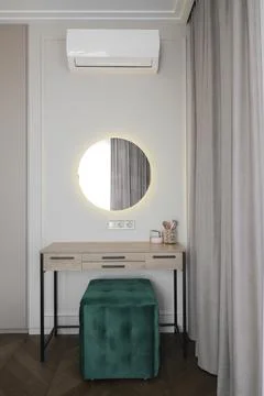 Modern dressing table with round mirror Stock Photos