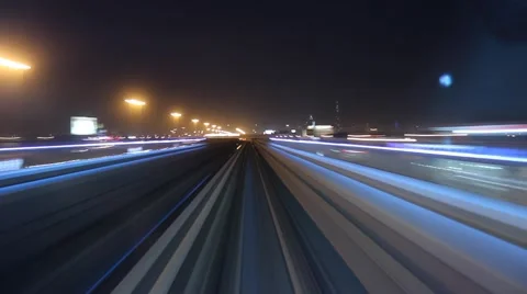 Modern driver-less metro train rush forward, along night Dubai, POV view Stock-Footage 59618125