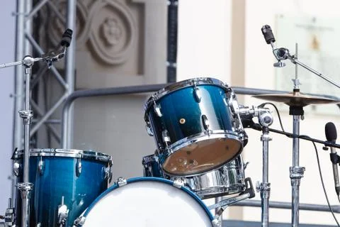 Modern drum set on open scene prepared for playing. Sunny day Stock Photos