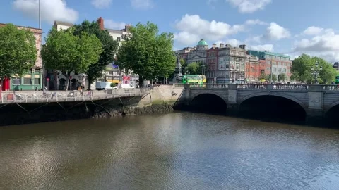 Modern Dublin double decker bus is crossing O'Connell Bridge. Dublin, Ireland Video stock 252430677