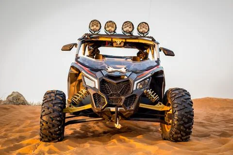 Modern dune buggy with light bar front view, parked on sand in the desert,UAE Stock-Fotos