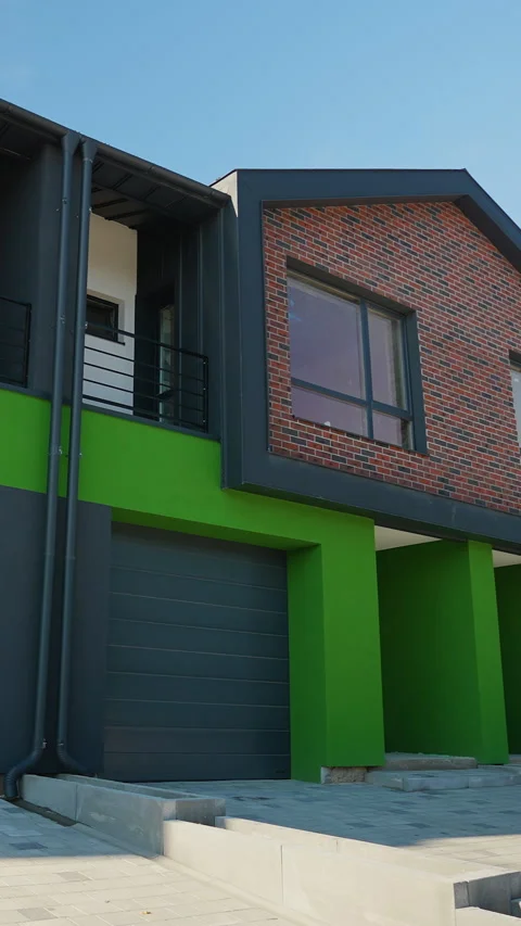 Modern Duplex Cottage with Stylish Brick and Green Design Stock Footage 297309636
