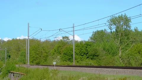 Modern dutch train passing in full speed Stock Footage 89408554
