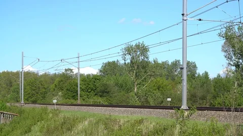Modern dutch train passing in full speed Stock Footage 89408566